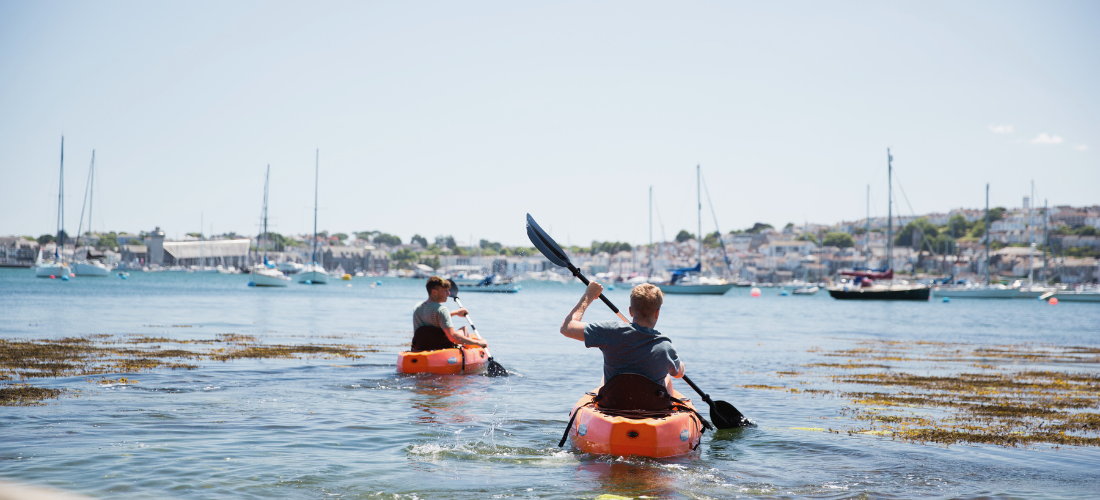 Family kayaking in Cornwall